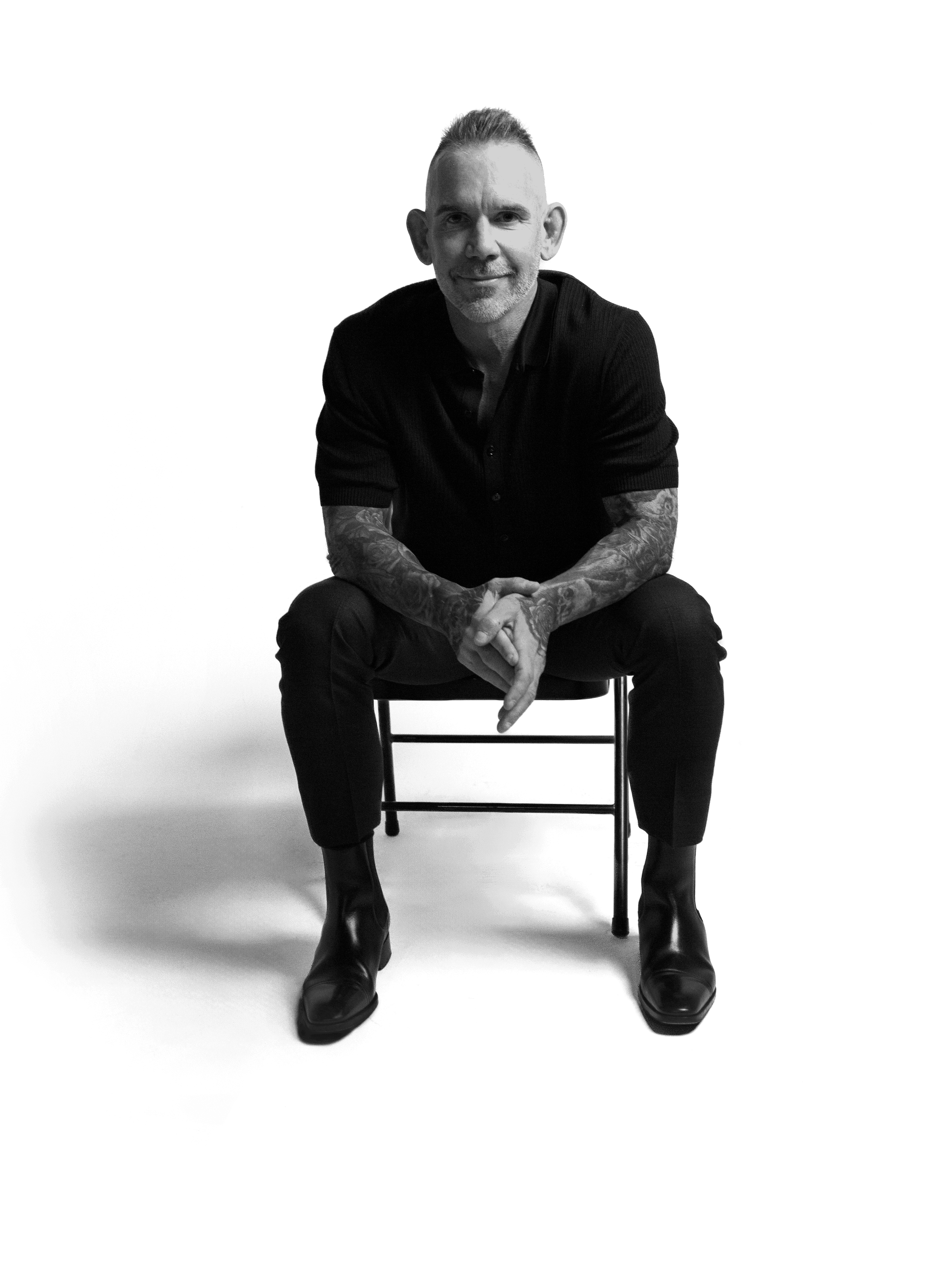 Image of Ron Perkins on a chair.